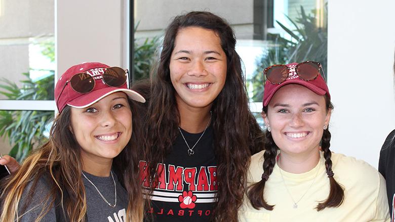 3 smiling Chapman female students